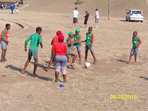 Children Playing Football In Africa