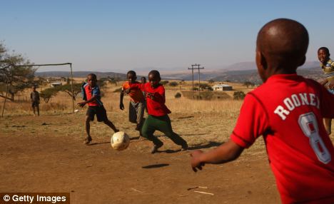 Children Playing Football In Africa