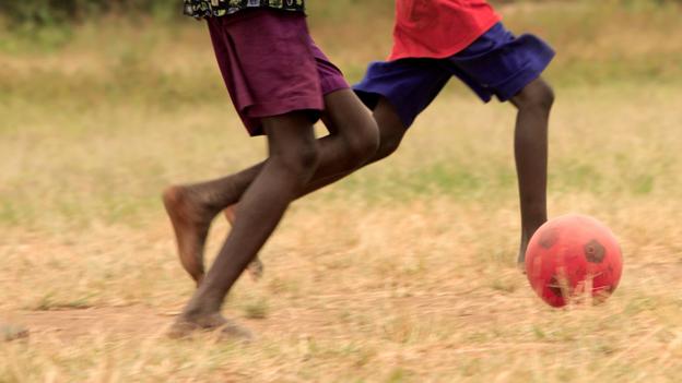 Children Playing Football In Africa