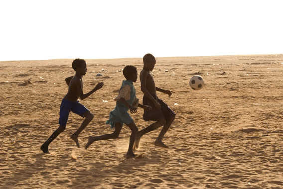 Children Playing Football In Africa