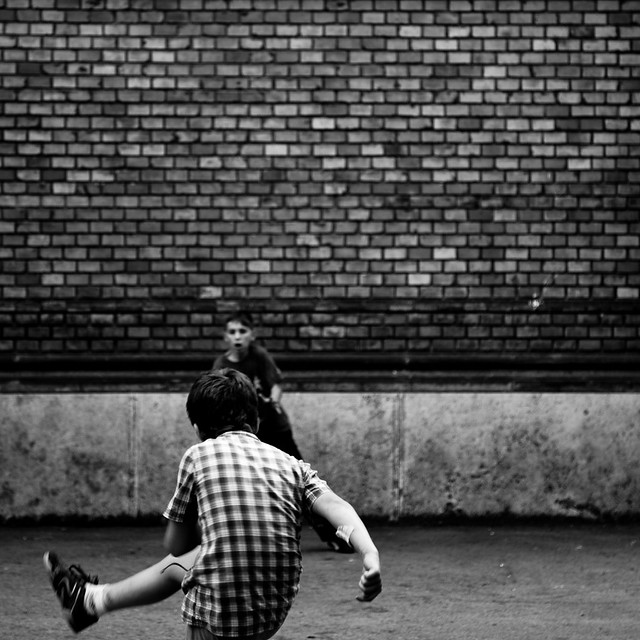 Children Playing Football In The Street