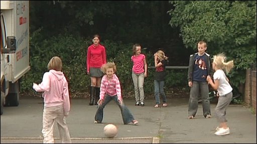 Children Playing Football In The Street