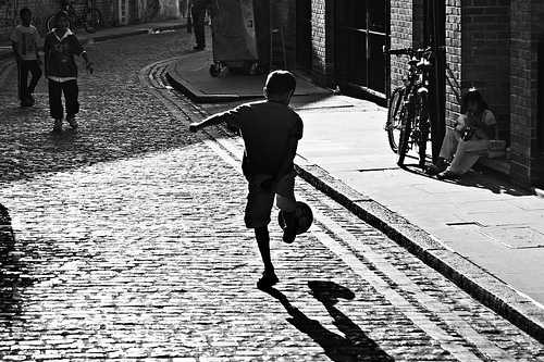 Children Playing Football In The Street