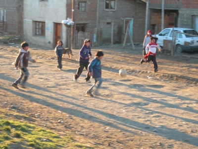 Children Playing Football In The Street